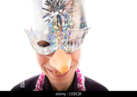 Funny ugly man wearing party mask smiling, isolated on white background. Stock Photo