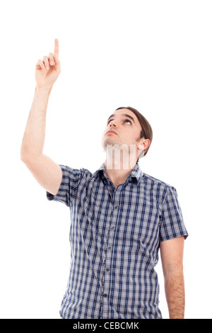 Young serious man pointing up, isolated on white background. Stock Photo