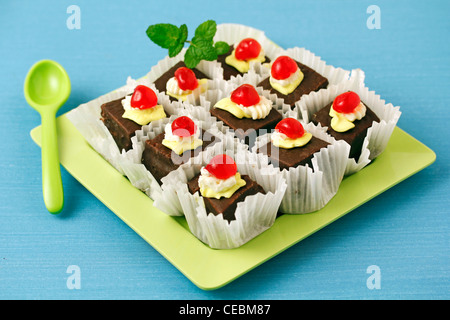 Little chocolate sponge cakes. Recipe available. Stock Photo