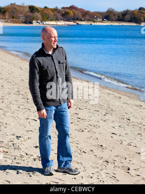 Handsome man in sweater going for a walk Stock Photo