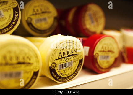 Local cheeses on display for sale at the Isle of Arran Distillery in Lochranza on the island of Arran. Stock Photo