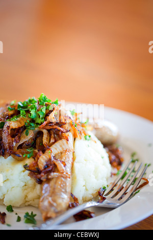 Sausages with mashed potatoes and fried onions at the pub Stock Photo