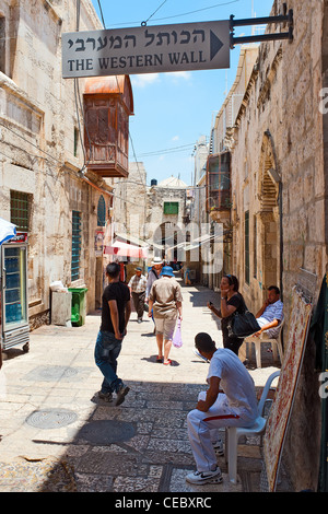 A street in the Arab quarter in the old city of Jerusalem. The sig directs people to the sacred Western Wall Stock Photo