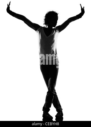 full length silhouette of a young man dancer dancing funky hip hop r&b on  isolated  studio white background Stock Photo