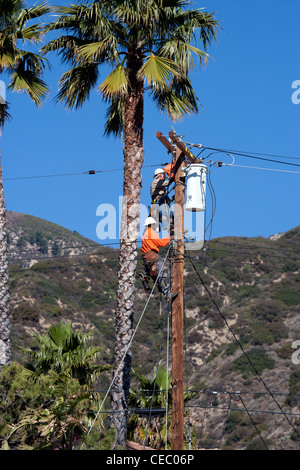 Two Men Working on Power Lines Stock Photo