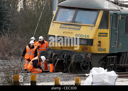 A derailed freight train blocks the West Coast Main Line near Bletchley causing widespread travel disruption Stock Photo