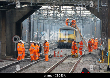 A derailed freight train blocks the West Coast Main Line near Bletchley causing widespread travel disruption Stock Photo