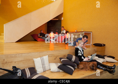 Employees in the lounge at the Skype Worldwide Headquarters, Tallinn, Estonia Stock Photo