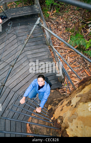 Woman climbing the spiral stairway of the Gloucester Tree, Gloucester National Park.  Pemberton, Western Australia, AUSTRALIA Stock Photo