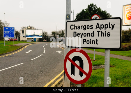 Sign at approach to airport terminal, warning that charges apply beyond this point Stock Photo