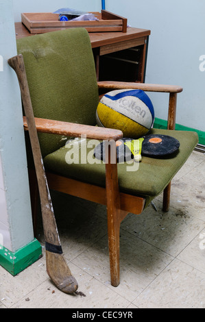 Sports equipment in the sports department of an old, run down school Stock Photo