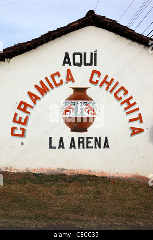 Painting on side of ceramics shop, La Arena, near Chitre, Azuero Peninsula, Panama Stock Photo