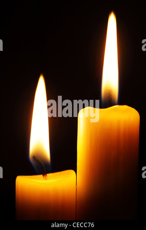 Many burning candles on black background Stock Photo - Alamy