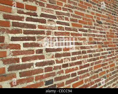 Old red brick wall useful as a background Stock Photo