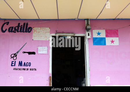 Detail of entrance to barbers shop and Panamanian flag, Las Tablas , Azuero Peninsula , Panama