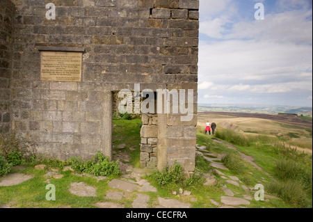 Walkers by Top Withens, crumbling farmhouse ruin on wild remote Pennine moors (Wuthering Heights?) - summer near Haworth, West Yorkshire, England, UK. Stock Photo