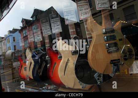 Selection of guitars pictured in 'The Guitar, Amp & Keyboard Centre' shop window in Brighton, East Sussex, UK. Stock Photo