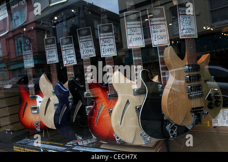 Selection of guitars pictured in 'The Guitar, Amp & Keyboard Centre' shop window in Brighton, East Sussex, UK. Stock Photo