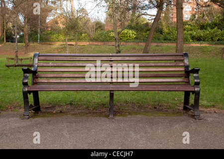 Empty park bench Stock Photo