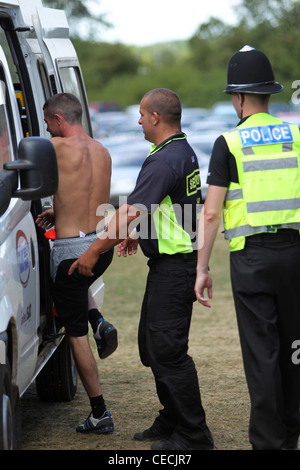 Man being led away into custody after arrest in Britain Stock Photo