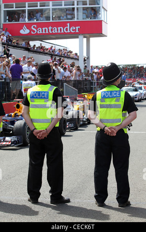 British Police guard the entrance to parc ferme at the Formula One British Grand Prix