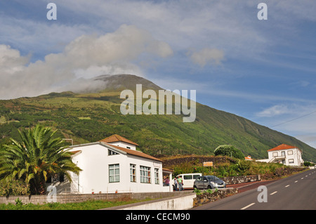 EUROPE, PORTUGAL, AZORES, Pico, São Mateus, typical street with Mt Pico (highest mountain in Portugal) at rear Stock Photo