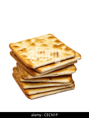 Pile of Jacobs cream crackers cheese biscuits on white background Stock Photo