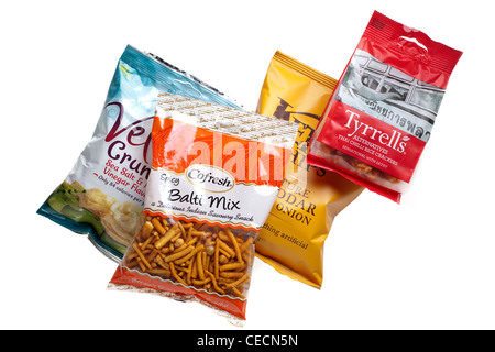 Four bags of crisps rice and crackers savoury snacks Stock Photo