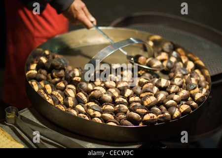 Roasted Chestnuts on a cold night in Rome Stock Photo