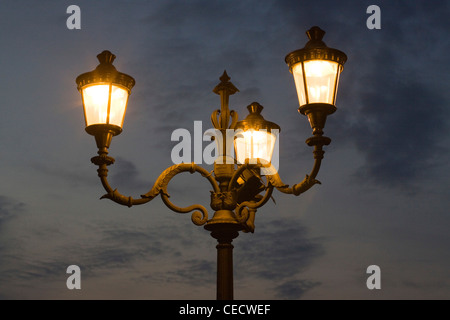 Street lighting at dusk in the city of Rome Italy Stock Photo