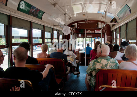 people riding a New Orleans Streetcar Stock Photo