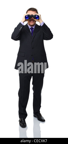 standing caucasian man holding binoculars Stock Photo