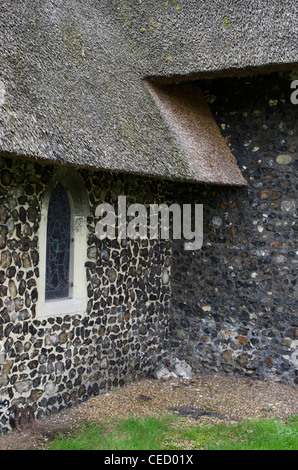 St Andrew's Church, Eaton, Norwich, Norfolk, England - thatched roof and flint walls. Stock Photo