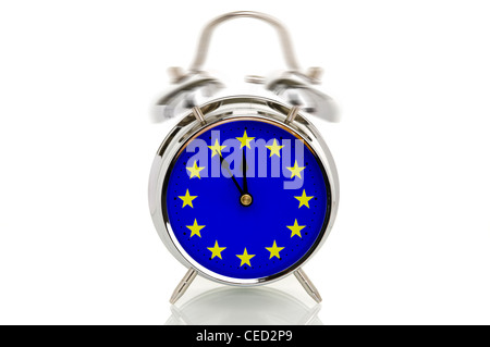 Ringing alarm clock with the European flag, time set to five minutes to twelve, symbolic image for the crisis in Europe Stock Photo