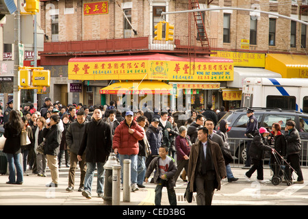 2012: People in Chinatown during Chinese New Year, The Year Of The Dragon, NYC Stock Photo