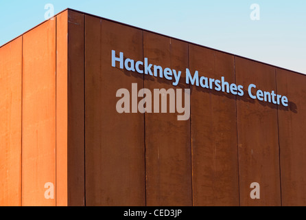 Corner of building shows the sign for Hackney Marshes Centre, a famous location of many football pitches, London. Stock Photo