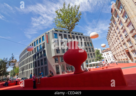 Horizontal wide angle of the bizarre red polymer carpeted Stadtlounge, City Lounge, in the centre of St Gallen on a sunny day Stock Photo