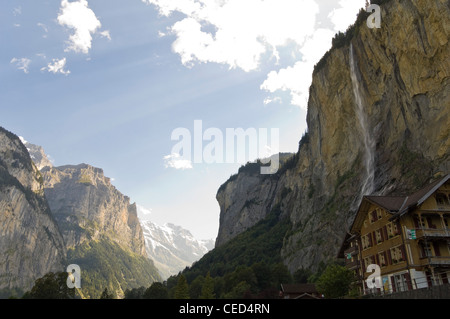 Horizontal wide angle view of the Staubbach Falls, one of the highest unbroken waterfalls in Europe, on a sunny day Stock Photo