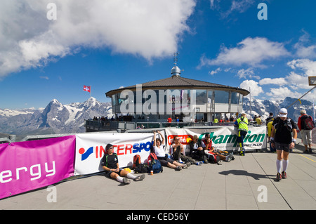 Horizontal view of the Schilthorn observation deck with tired athletes having run the Inferno Triathlon on a sunny day. Stock Photo