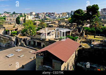 A view from the south east over the well preserved ruins of Herculaneum to the modern town of Ercolano which stands over the it Stock Photo