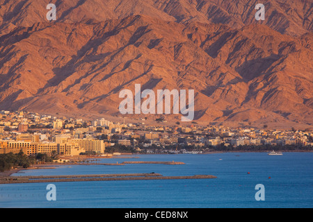 Israel, The Negev, Eilat, Red Sea beachfront, sunset view towards Aqaba, Jordan Stock Photo