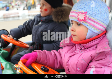 children on carousel, waiting for start Stock Photo