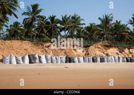 Coastal erosion at Sinquerim, Goa, India. Stock Photo