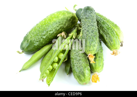 Green cucumbers and peas isolated on a white background Stock Photo