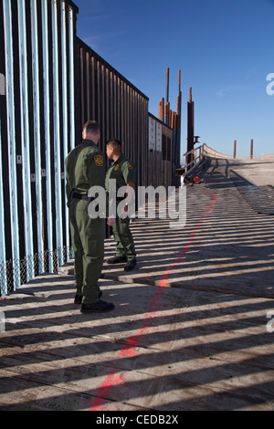 CBP Border Patrol agents inspect vehicles at a South Texas checkpoint ...