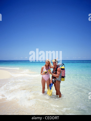 Couple scuba diving, Kuda Bandos, Kaafu Atoll, Republic of Maldives Stock Photo