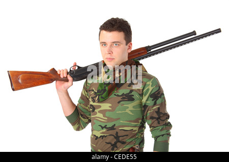 man in camouflage with gun on shoulder Stock Photo