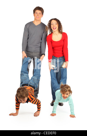 parents hold children for legs, focus on little girl Stock Photo