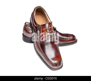 A new pair of brown leather dress shoes on a white background