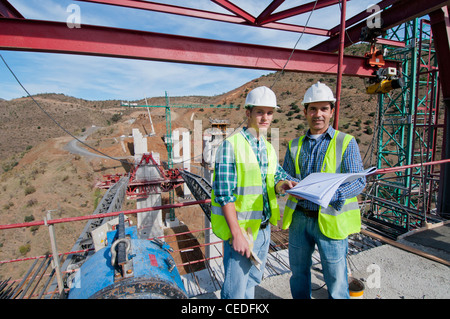 Construction workers standing at construction site Stock Photo